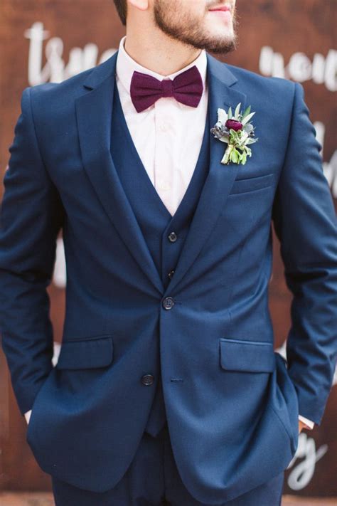 navy suit burgundy bow tie